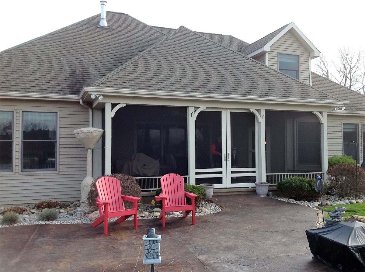 screened porch and custom stain and stamp patio by Archadeck of Fort Wayne